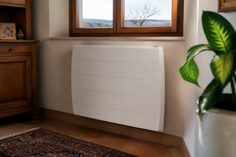 Radiateur à inertie sèche blanc dans un salon avec fenêtre en arrière-plan